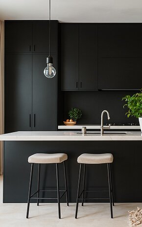 Minimalist kitchen with black cabinets and beige stools - Florida Luxury Kitchens